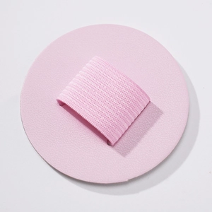 Close-up of pink PU leather adhesive pen holder with elastic loop for notebooks