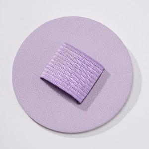 Detail view of round purple PU leather pen holder with elastic band for notebooks