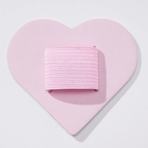 Close-up of pink heart-shaped PU leather pen holder with elastic loop for notebooks