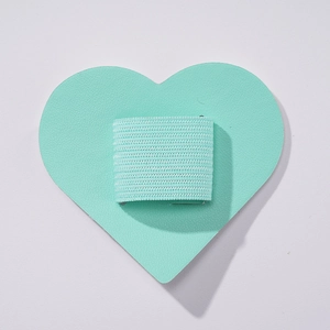 Detail of mint green heart PU leather pen holder with elastic loop for notebooks