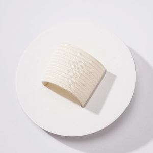 Close-up of white elastic PU leather pen holder showing ribbed texture and round design