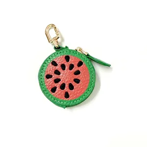 Detail of watermelon shaped PU leather coin purse with embroidery and metal clasp