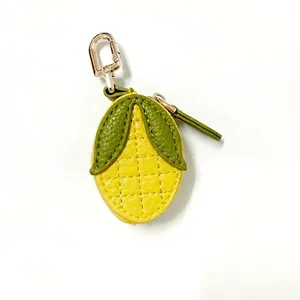 Detailed close-up of a corn-shaped PU leather coin purse with golden metal zipper and hook