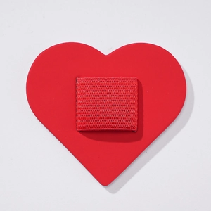 Detail of red heart PU leather pen holder with elastic loop for notebooks
