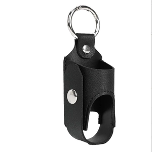 Detail of black leather spray bottle holder with silver metal key ring and button snaps