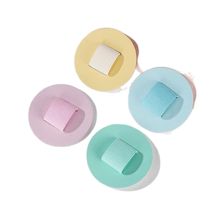Set of four pastel macaron round powder puffs with elastic finger bands in macaron colors