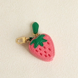 Cute pink strawberry leather mini coin purse with green leaf detail and gold hook