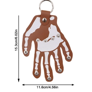 Brown leather hand keychain with bone patterns and metal rivets on white background