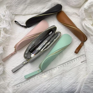 Minimalist PU leather S-shaped pen pouches in multiple colors with gold zippers