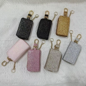 Set of seven glitter leather car key pouches with zippers and golden metal carabiners
