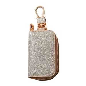 Detail of glitter champagne gold car key case with rose gold zipper and swivel hook