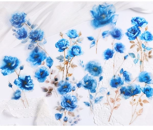 Close-up of translucent blue rose PET stickers with elegant lace and silk details