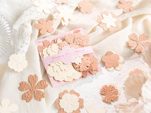 Detail of embossed floral paper stickers for DIY journaling with cherry blossom design