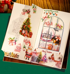 Detail view of die-cut Christmas stickers with watercolor Santa and tree illustrations