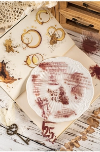Close-up of vintage PET stickers featuring musical scores, coffee stains and ink splatters