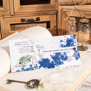 Vintage PET-Aufkleber mit blauen Tuscheflecken auf altem Buch für DIY-Scrapbooking