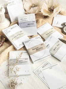 Macro detail of vintage black and white notepad sheets with artistic stationery props