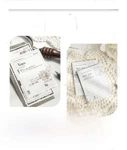 Detailed view of vintage black and white memo pad with Wish List and daisy illustrations