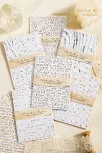 Dettaglio di carta artistica bianca intagliata a laser per scrapbooking e collage fai-da-te