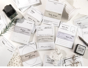 Detailed close-up of retro Life Mark Series paper notes with vintage stationery props