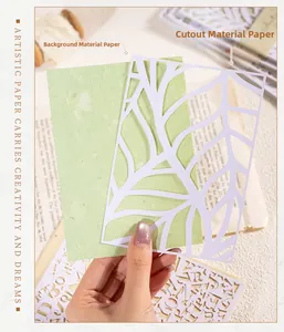 Primo piano di carta intagliata al laser e carta artistica verde chiaro per il fai da te