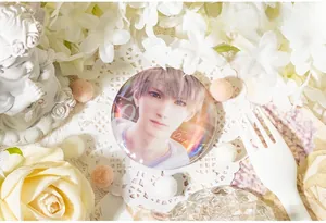 Close-up of laser finish anime character badge with sparkling holographic effect on lace