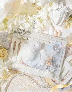 Macro shot of white lace material pack with pearls and roses for DIY bag decoration