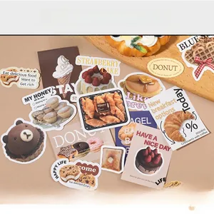 Flat lay of Korean style scrapbooking stickers featuring dessert patterns and cute bear motifs