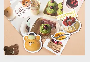 Close-up of cute Korean style DIY scrapbook stickers with dessert and animal themes