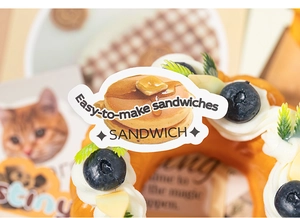 Macro shot of creative food stickers featuring pancakes and blueberry illustrations