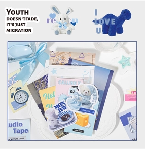 Detail of blue and white stationery set with rabbit plush and aesthetic art stickers