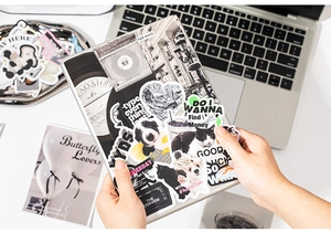 Close-up of Korean style aesthetic stickers featuring pet motifs and inspirational quotes