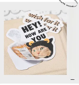 Detailed view of DIY heart market cat stickers on beige fabric with easy-to-tear edge
