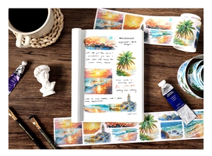 Macro shot of scenic watercolor washi tape rolls for DIY scrapbooking decoration