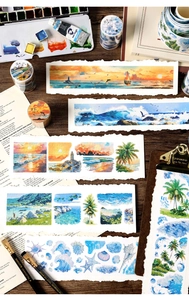 Watercolor ocean washi tape with nautical motifs on a creative wooden art workspace