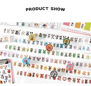 Close-up of cute animal themed decorative washi tape and stickers on a stationery desk