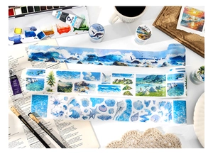 Artistic workspace with sea-themed decorative washi tapes featuring waves and shells