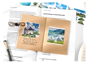 Detail of vintage kraft notebook with watercolor ocean scenery stickers and pens