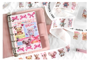 Detailed close-up of cute animal washi tape featuring plush elephant and bear designs