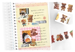 Detailed macro view of die-cut washi tape featuring cute teddy bear and animal illustrations