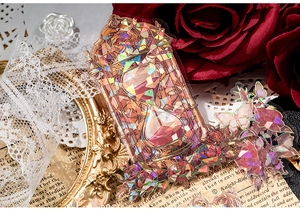 Detail eines Laser-PET-Stickers mit Vintage-Sanduhr und Rose für Scrapbooking-Dekor