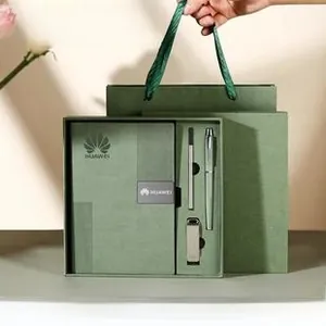 Detail of premium green A5 leather notebook set with metal pen and USB drive in a gift box