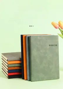 Macro detail of high-quality soft PU leather A5 business notebooks in multiple colors