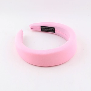 Detail of pink sponge headband with silky fabric and Hand Made woven inner label