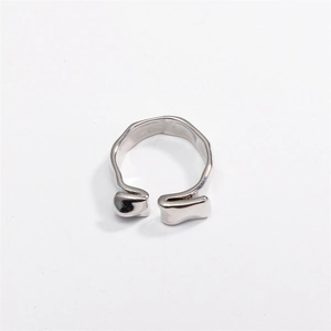 Detail of the irregular lava texture and polished silver finish on the open ring