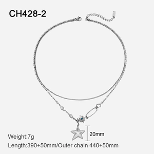 Detail of double-layered stainless steel necklace with star and blue gem sun pendant