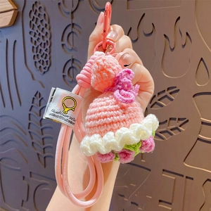 Handmade crochet flower dress keychain with pink knit lace and a durable hanging clasp