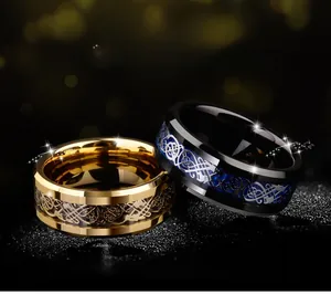 Detailed macro of gold and blue tungsten rings featuring intricate Celtic knot engravings