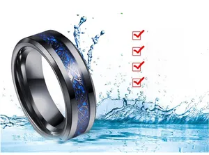 Detail of waterproof stainless steel ring with blue Celtic dragon inlay and water splashes