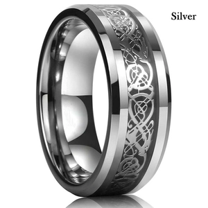 Detail of silver titanium steel ring with intricate Celtic dragon pattern engraving